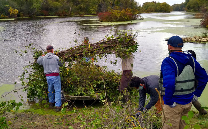 stacking brush bundles on boat