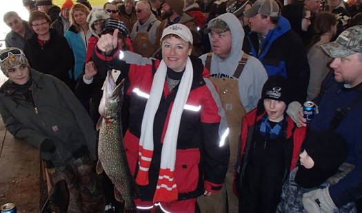The crowd admires Denise Oien's winning northern pike.
